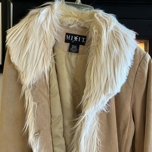 Ladies knee length fashion coat. Faux Fur, very good condition.
